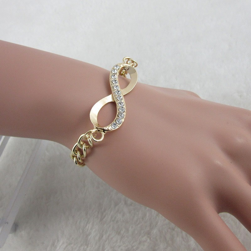 Bracelet " INFINI " doré et strass.||Bracelet " INFINI " doré et strass.||Bracelet " INFINI " doré et strass.